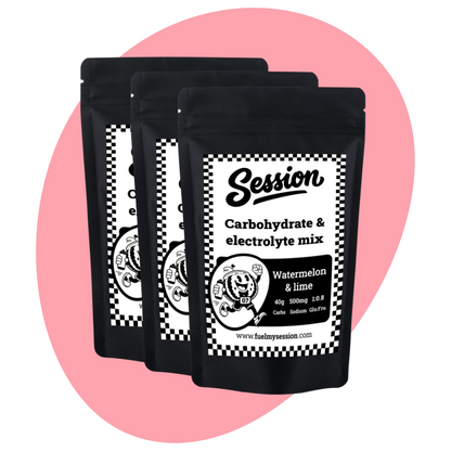 Three black packages of Session Carbohydrate & Electrolyte Mix on a pink background